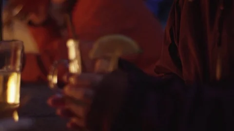 Focus Push to Close Up of Woman's Hands Around Hot Drink in front of Fire 動画素材 83359107