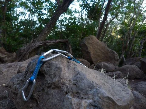 Focus on quickdraws put down on a rock with blurred front and back Stock Photos