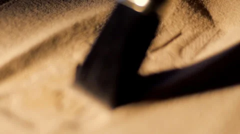 Focus racks to archaeologist brushing sand from ancient Egyptian carving Stock Footage 35269400