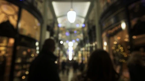 Focus ramping view of Christmas lights in an arcade in Piccadilly, London Stock Footage 102436556