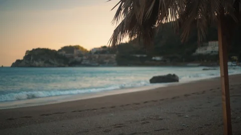 Focus ramping view of a sandy beach near Taormina (Sicily) before sunset Stock Footage 120290390