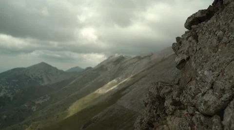Focus from Rocks to Mountain Range 4K Stock Footage 67477719