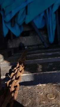 Focus to rusty chain on foreground and blurred background in shadow Stock Photos