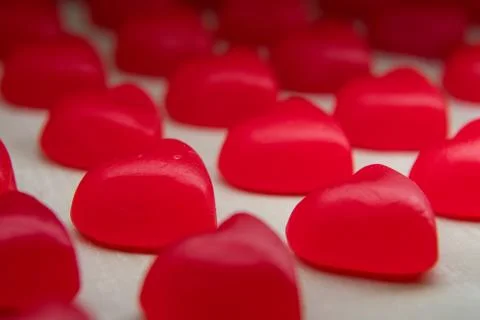 Focus on Second Row in Line of Gummy Hearts 写真素材