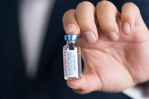 Focus select and blur Foreground Vaccine COVID-19 corona virus and syringe .. Stock Photos