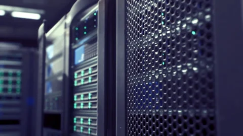 Focus on server rack with vibrant blue lighting and ventilation 動画素材 343626197