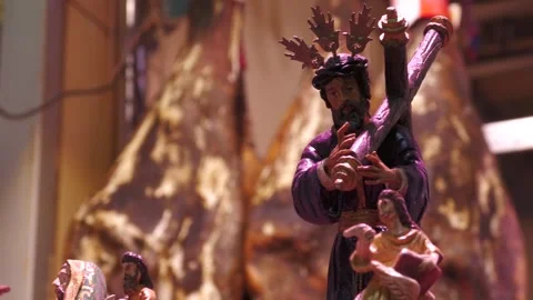 Focus Shift From Christ Statue to Spanish Ham in Seville Stock Footage 336015187