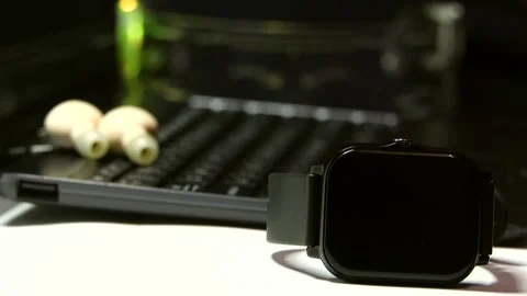 Focus shift from cybernetic glowing multicolored glasses to smartwatch Stock Footage 342257320