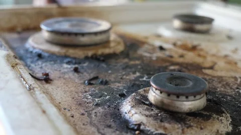 Focus Shift to Extremely Burnt Stovetop Stock Footage 284968413