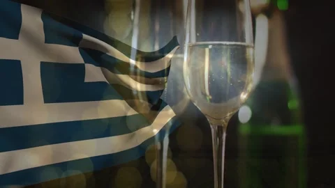 Focus shift initiating Greek flag rippling and champagne flute sparkling, Stock Footage 329928727