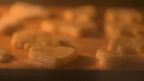 Focus shift over cookies on a baking sheet that are baked in the oven,close-up Stock Footage 127629697