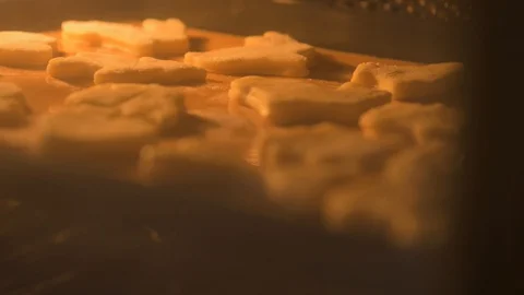 Focus shift over cookies on a baking sheet that are baked in the oven,close-up Stock Footage 127629729