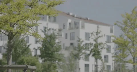 Focus shift from trees to building Stock Footage 78028318