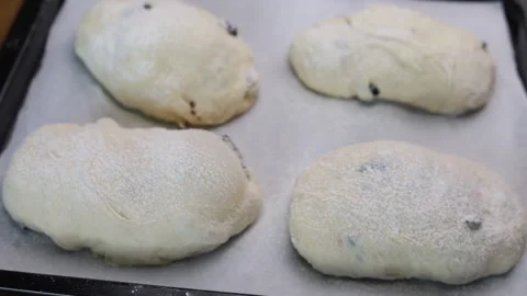The Focus Shifts From Defocus To Focus Of Bread Doughs On Baking Tray Stock Footage 160146176