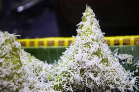 Focus Shot of Triangular Green Lupis Sticky Rice Cake Topped with Shredded .. Stock Photos