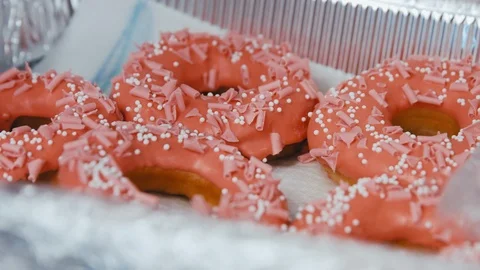 Focus slide on Delicious donuts in the box Stock Footage 124842891