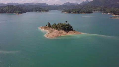 Focus of a small island on the Khao Sok lake in Thailand Stock Footage 123712710