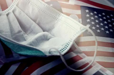 Focus on some points of Surgery mask on United State flag Background. Stock Photos