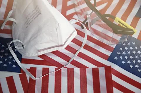 Focus on some points of Surgery mask on United State flag Background. Stock Photos