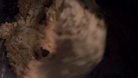 Focus on spiral of industrial bread machine working the dough Stock Footage 226369587