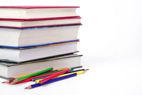 Focus on stack of books and blur pencil on white background. Knowledge and .. Foto stock