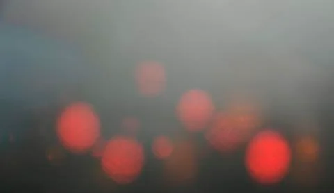 Off focus tail light red light defocus bokeh. Stock Photos