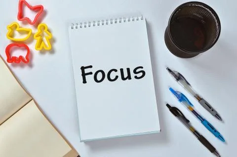 Focus text on notepad with office accessories. Business motivation, inspirati Stock Photos