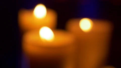Focus on Three Candles in the dark Stock Footage 73926302