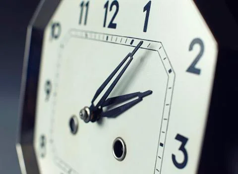 Focus on tips of hand with strong depth of field on an antique watch Stock Photos