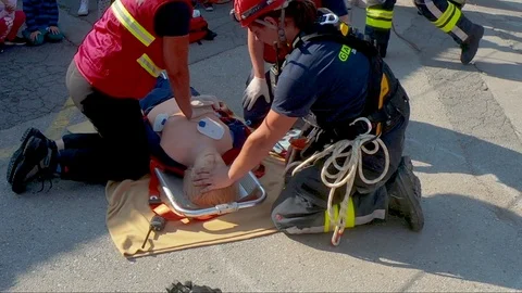 Focus on training mannequin as firefighter does chest compressions for CPR. Stock Footage 96676354