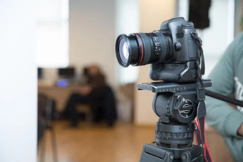 Focus on tripod mounted camera screen showing . Photo camera set on a tripod  Stock Photos