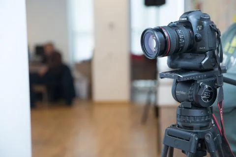 Focus on tripod mounted camera screen showing . Photo camera set on a tripod  Stock Photos