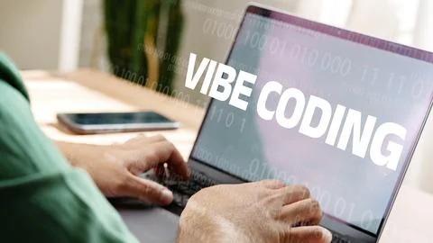 Focus on vibe coding while working on a laptop at home in the afternoon Stock Photos