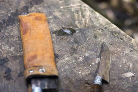 Focus view of butcher knife on the table. Balinese meat cutting knife. Stock Photos