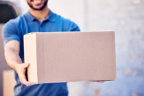 Focus on what to do next. a unrecognizable delivery man holding a pile of boxes. Stock Photos