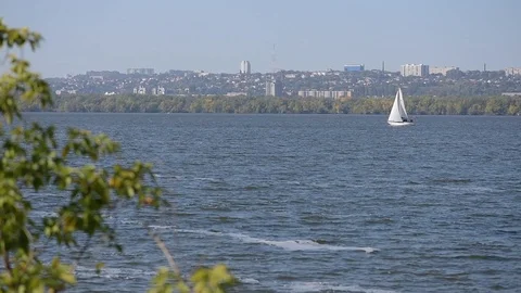 Focus on white sailboat move on river Stock Footage 97407592