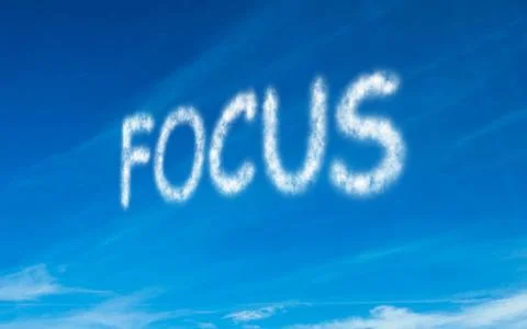 Focus written in white in sky Ilustração Stock