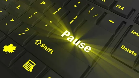 Focus on the yellow glowing Pause button Stock Footage 100688849