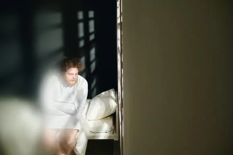 Focus on young deranged man suffering from strong mental disability Stock Photos