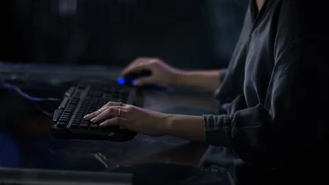 Focus on young womans hands playing on a computer Stock Footage 101253053