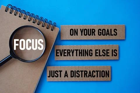 FOCUS ON YOUR GOALS EVERYTHING ELSE IS JUST A DISTRACTION. Motivational quote Stock Photos