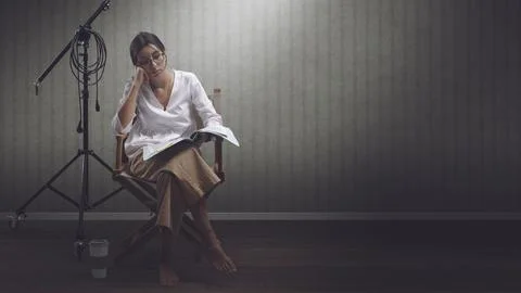 Focused actress reading a script Stock Photos