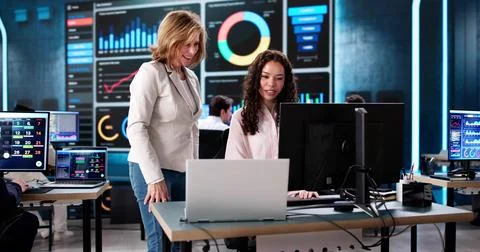 Focused African American data analyst analyzing KPI dashboard Stock Photos