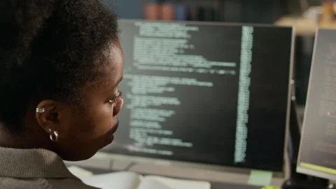 Focused African American Female Programmer Checking Program Codes on Screen Stock-Footage 306832253