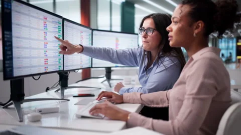 Focused Analyst Examining Data On Computer Stock Footage 328713703
