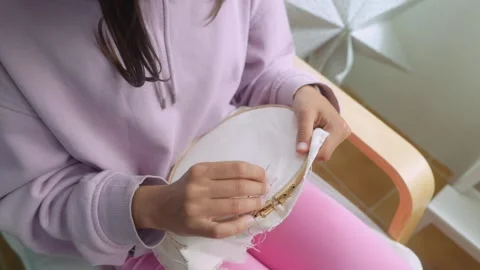 Focused artisan creates rhythmic needle stitches gently Stock-Footage 346482038