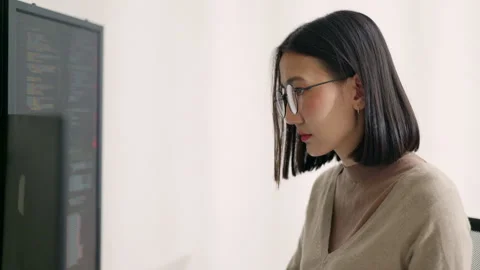 Focused Asian Female Programmer Coding in Modern Office. Stock Footage 310589207