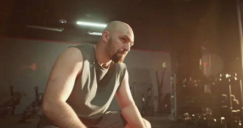 Focused athlete doing wrist exercise at fitness club Stock Footage 272370994