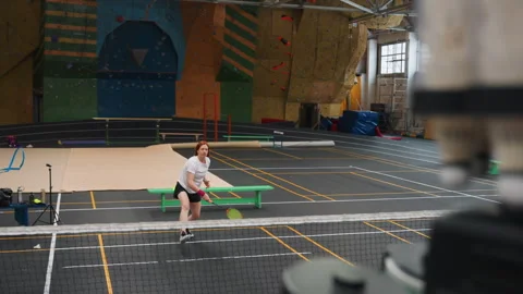 Focused athlete performing highspeed badminton drills. Disciplined athlete Stock Footage 341768177