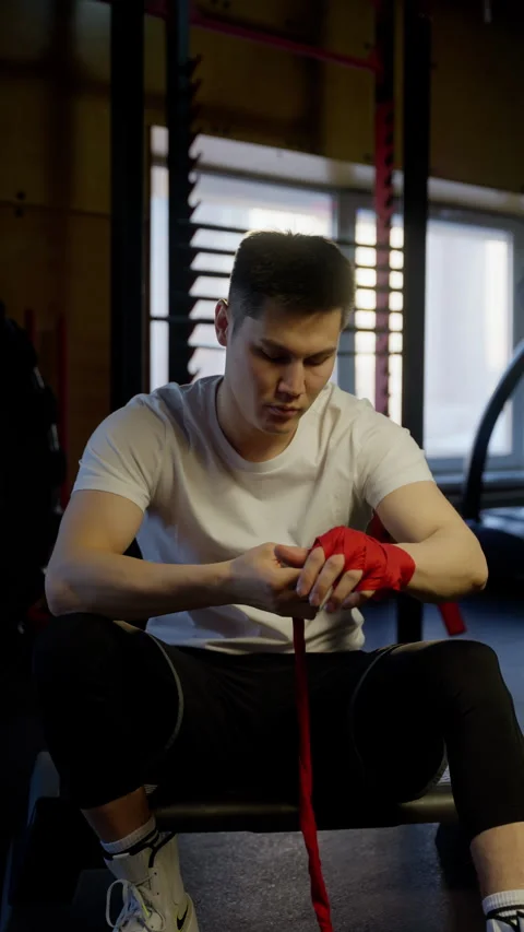 Focused Athlete Wrapping Hands Before Training. Stock Footage 261301169